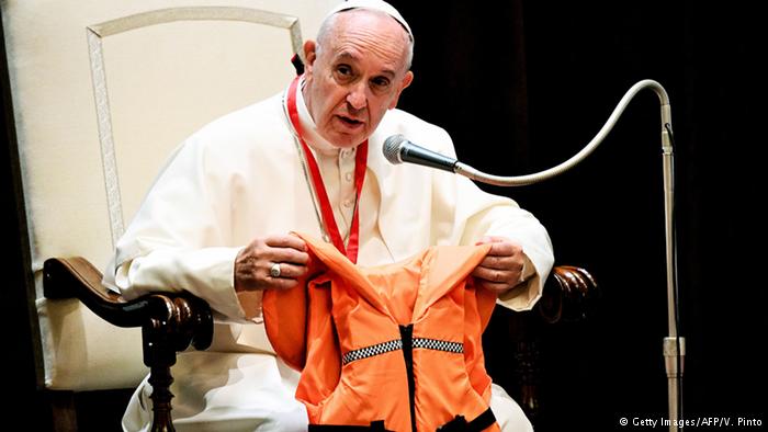 Pope says migrants are `not dangerous, but in danger`