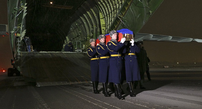 Body of Russian bomber pilot Oleg Peshkov arrives in Moscow