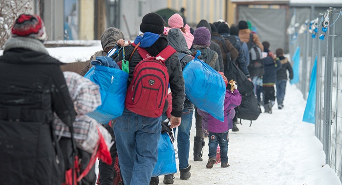 Germany denies plans to cut refugee reception by half