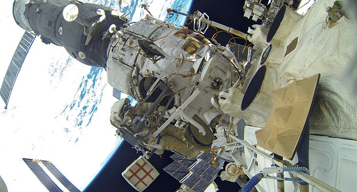 Space station crew members return to Earth after one-year mission