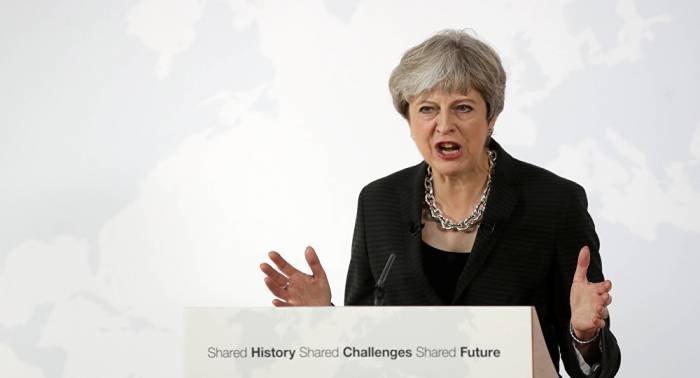 Theresa May defiende el libre mercado capitalista