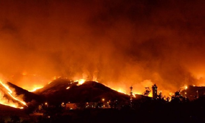 California wildfire triples in size as heatwave looms