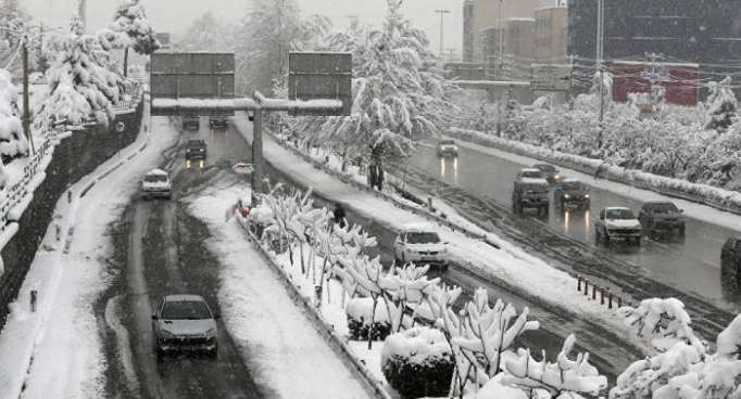 Iran buried under snow, blocking roads, shutting air traffic