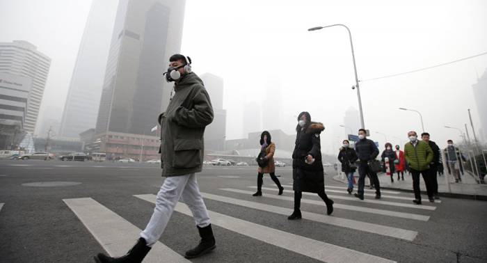 Beijing city authorities declare yellow air quality alert over smog