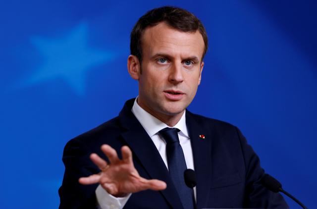 Emmanuel Macron plays down diplomatic spat with Italy