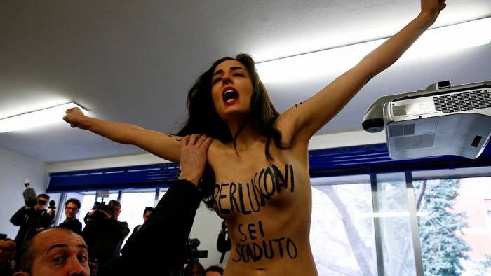Femen protest as Berlusconi casts ballot in general election - NO COMMENT