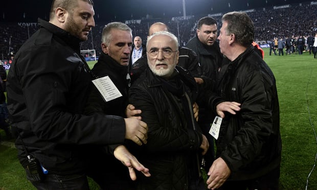 Greek football match stopped after team owner invades pitch with a gun