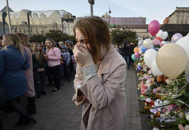 Russia buries victims of mall blaze as flags fly at half mast
 