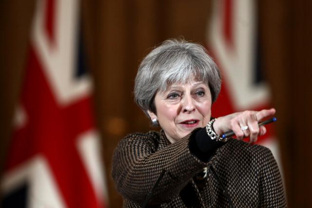 British PM May defends Syria strikes against parliament critics
 