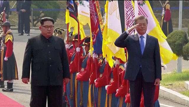 Kim, Moon meet at DMZ for historic summit between North and South Korea