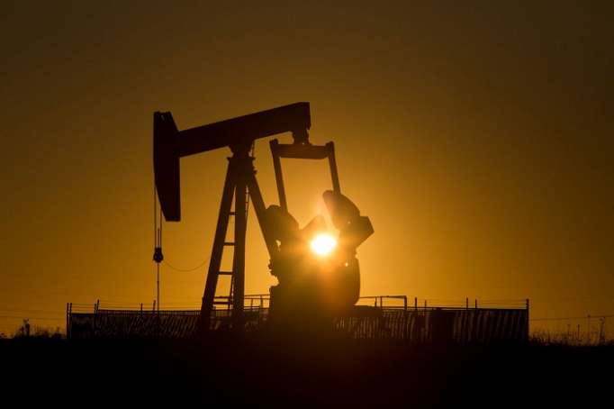 Oil firms on Iran sanction worries, but surging U.S. supplies cap market
