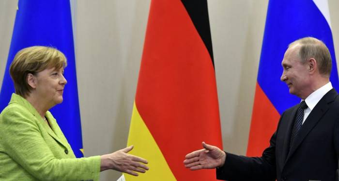 Iran: Poutine et Merkel pour le maintien de l