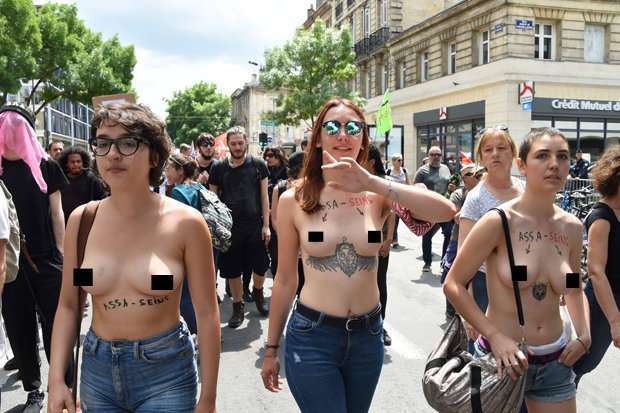 Topless protesters take to French streets as major strikes cripple country - PHOTOS