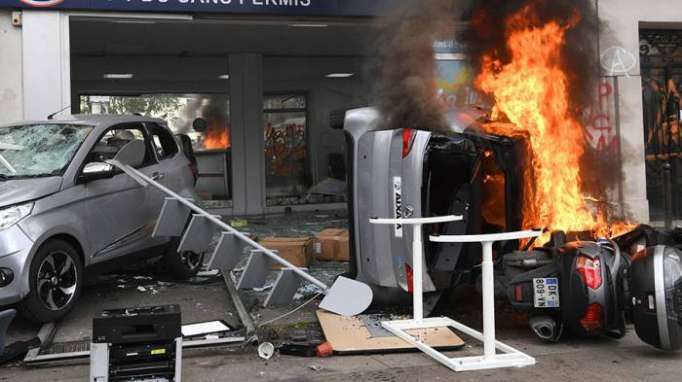 May Day riot in Paris: Masked protesters torch cars, police deploy tear gas