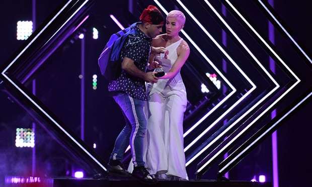 Man invades stage and grabs mic during UK Eurovision song