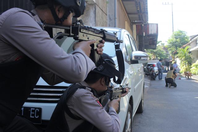 Militant family uses child in suicide bomb attack on Indonesian police  