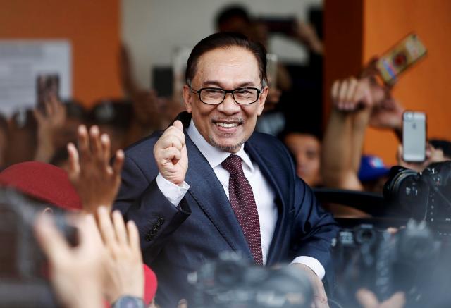 Jailed Malaysian leader Anwar Ibrahim walks free after royal pardon
 