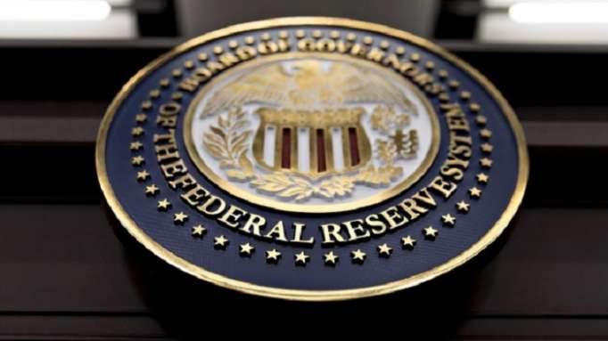 La Fed relève ses taux, ses prévisions de croissance et d