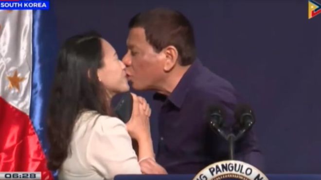 Philippine President Duterte condemned for kissing overseas worker