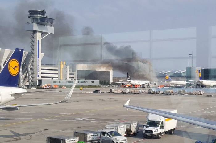 Plane catches fire at Frankfurt Airport after towing truck burst into flames