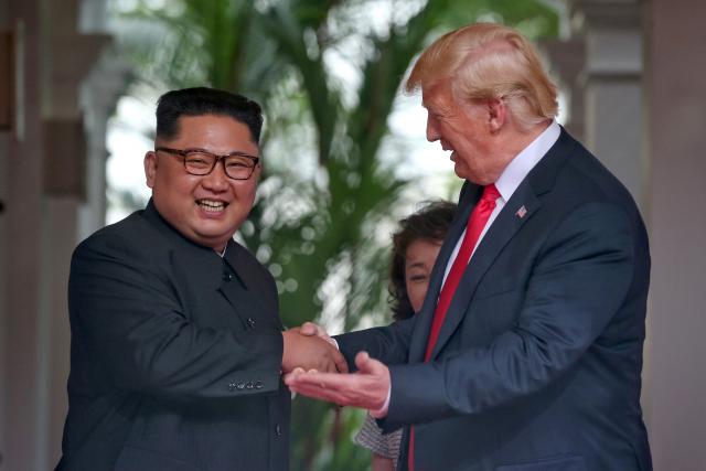 Trump in surprise summit move says he will halt Korea war games
 