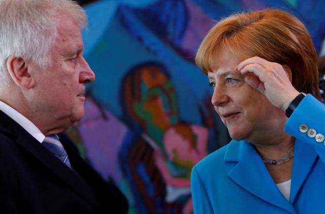 Defiant Merkel backs Europe migrant policy as Bavaria row simmers
 