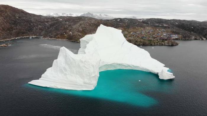 Iceberg as tall as Big Ben is threatening a village in Greenland