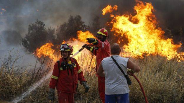 Greece wildfires: Reports say at least 50 dead - UPDATED