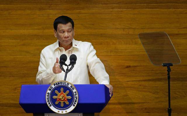 Philippine leader approves autonomy law for troubled Muslim region