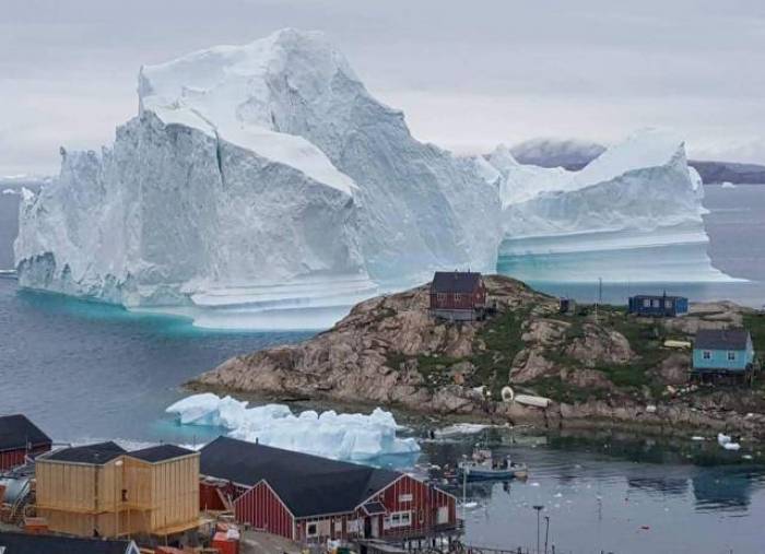 Huge iceberg drifts close to Greenland village, causing fears of a tsunami
 