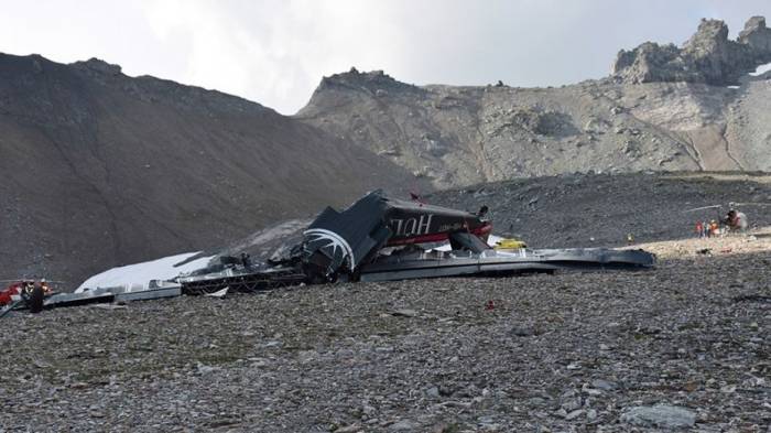 Finding cause of Swiss Alps vintage plane crash proves major challenge; 20 killed