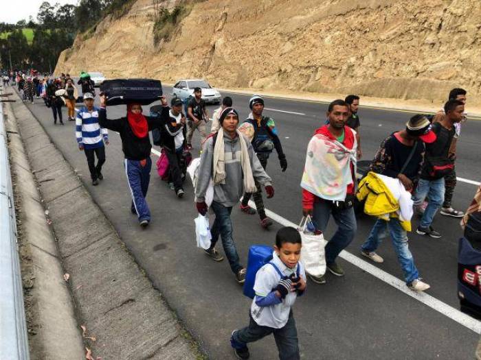 Venezuelans flood into Ecuador, defying passport rules