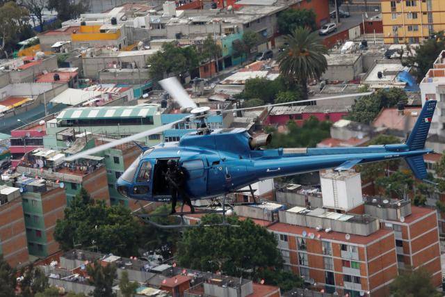 Police choppers thump over Mexico City as drug crime rises  