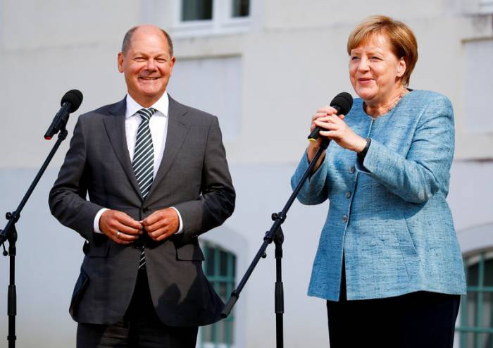 Merkel und Scholz - US-IT-Konzerne müssen sich Gesetzen unterordnen