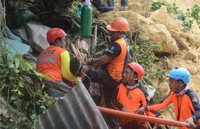 Landslide in Philippines kills four, dozens feared trapped