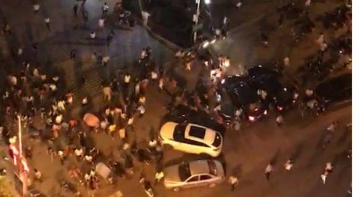 Eleven killed in China as car plows into square, driver attacks people
 