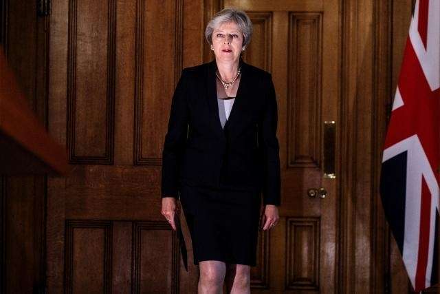 May vows to hold nerve after Brexit talks hit impasse
 