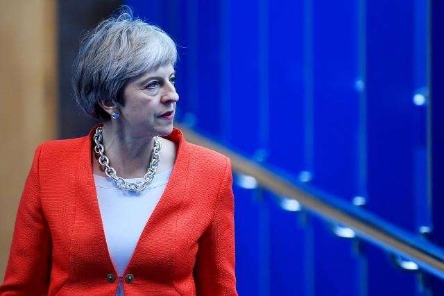 As Brexit divisions widen, PM May challenges Brexit critics
 