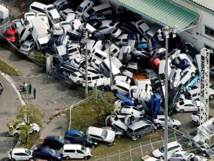 Typhoon kills 10 in Japan, boats move stranded passengers from airport  