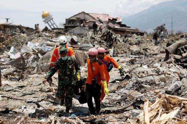 French volunteers in Indonesia search for bodies in jumbled mire
 