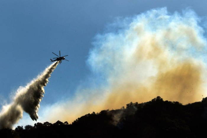 California wildfires: Rain helps ensure Camp Fire blaze is nearly fully contained although hundreds remain missing