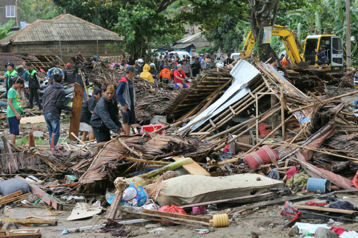 Indonesian rescuers use drones, sniffer dogs as tsunami death toll rises
