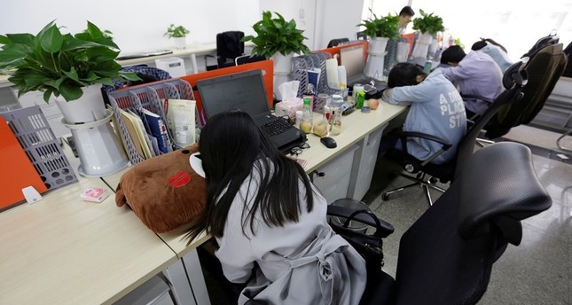 Japanese firms encourage workers to take nap breaks to fight epidemic of sleep deprivation