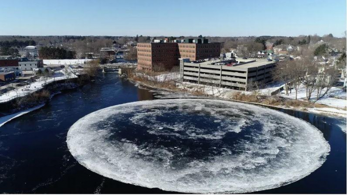 Colossal spinning disc of ice suddenly appears in river  