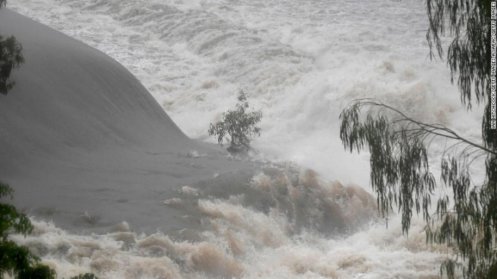 20,000 homes at risk in Australia floods as crocodiles, snakes wash up