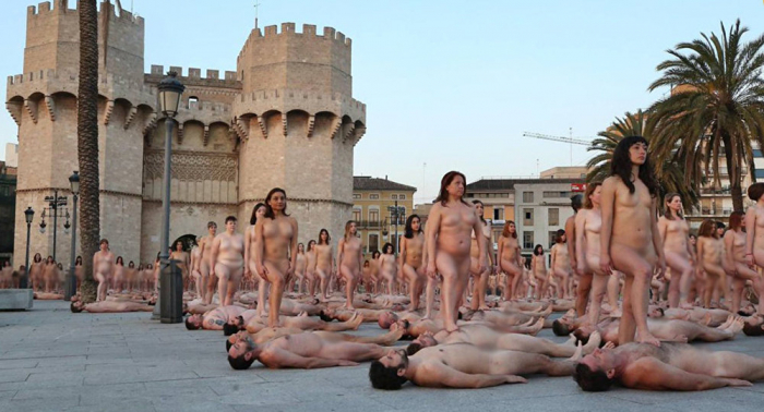 Hundreds take part in  NUDE PHOTO shoot  for female empowerment in Spain