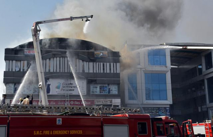 Indian police file case against three over coaching center fire, death toll rises to 20  
