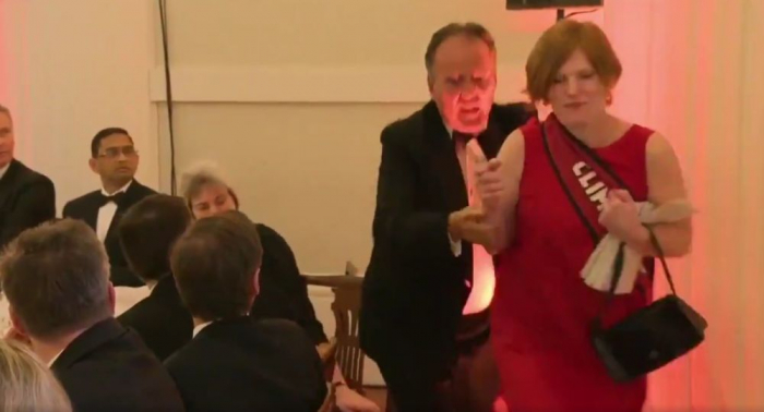   UK junior minister suspended after grappling with eco-protester -   VIDEO           
