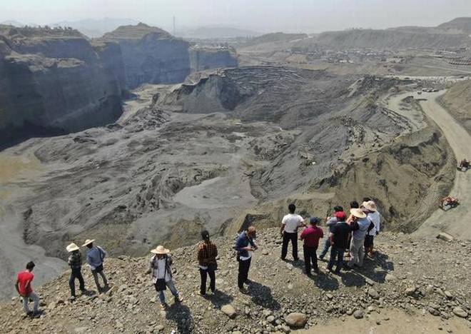 Police among 18 feared killed in landslide at Myanmar jade mine