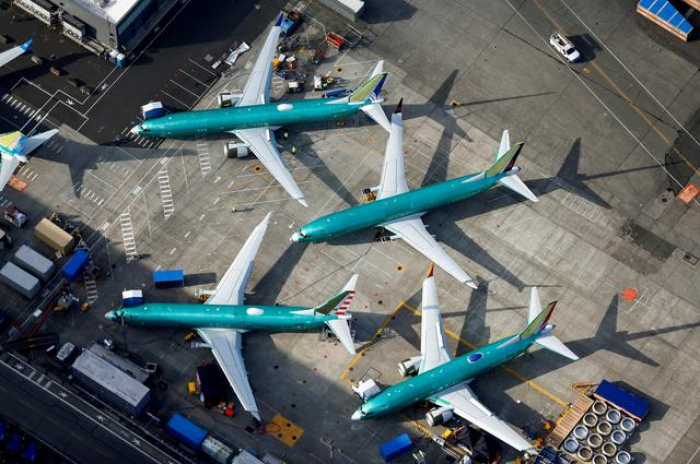 Boeing takes $4.9 billion charge for prolonged grounding of 737 MAX planes  